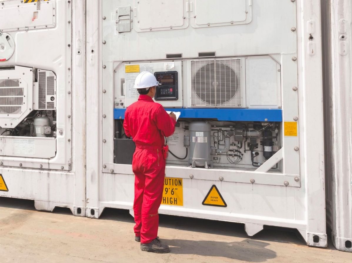 Worker at temperature controlled containers