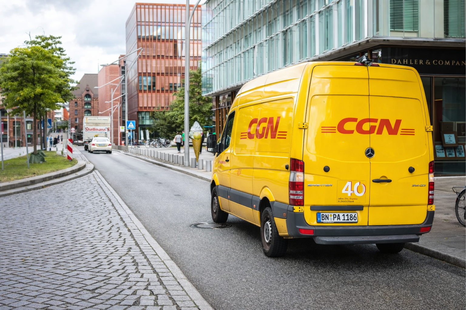 CGN Express yellow delivery van on city street